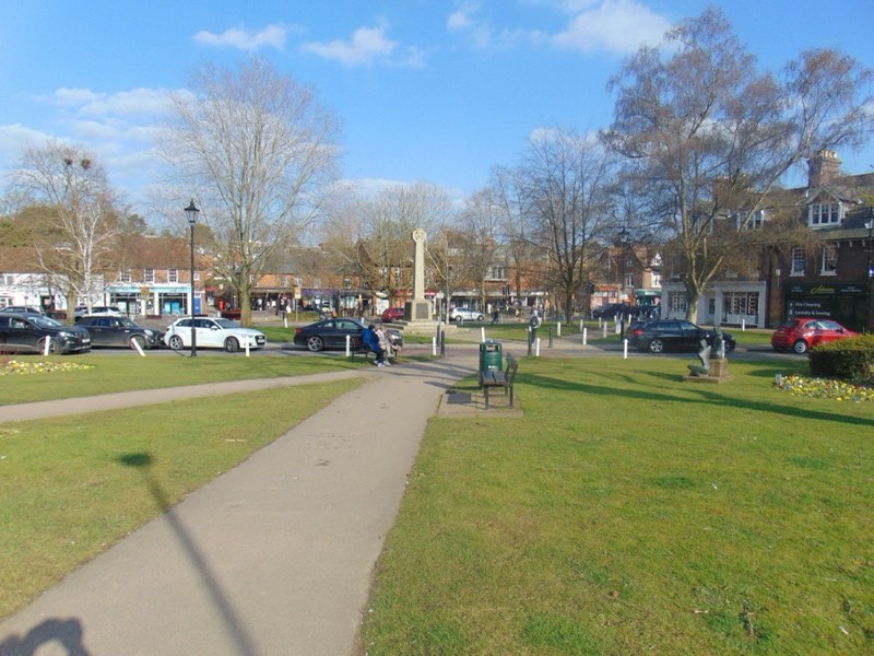 The war memorial on Harpenden Green, with the village beyond