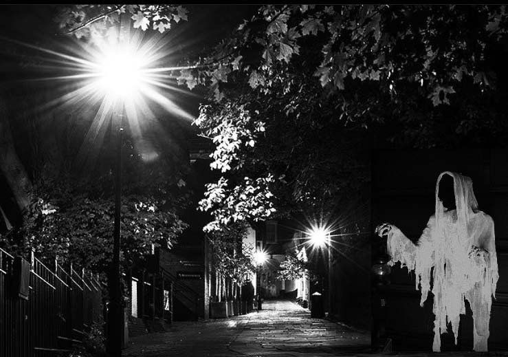 A ghostly figure in the lamplit Waxhouse Gate alleyway at night